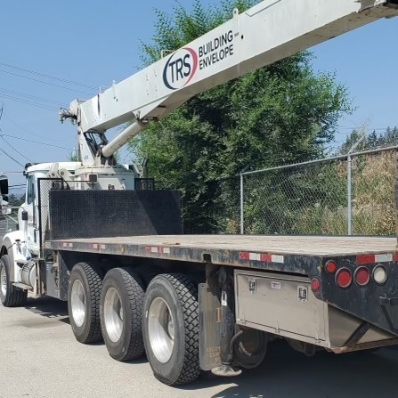 Underbody box for tridrive crane truck.